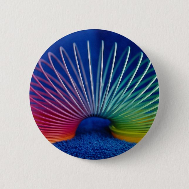 Rainbow-coloured slinky toy 6 cm round badge (Front)