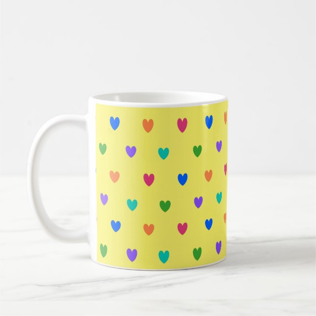 Rainbow polka hearts on yellow coffee mug (Left)