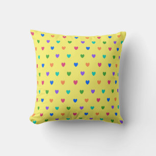 Rainbow polka hearts on yellow cushion