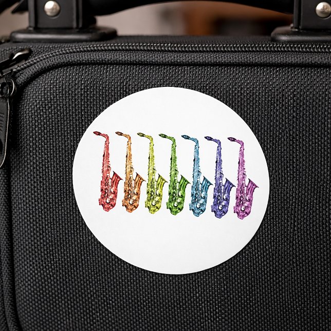 Rainbow Saxophone Lineup Classic Round Sticker (A rainbow lineup of alto saxophones on a sticker)