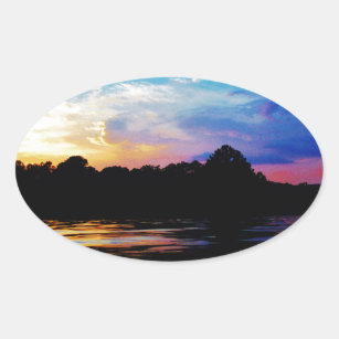 Rainbow sunset on mountain Lake Oval Sticker