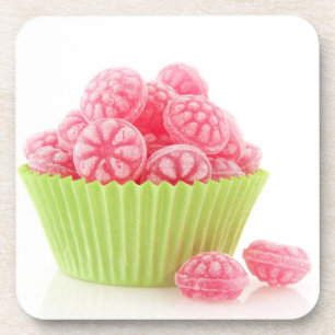 Raspberry tasty candy sweets in green cup cake coaster