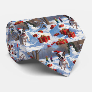 Rat Terrier Running in Snow with Christmas Hat Tie