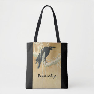 Raven on a tree branch tote bag