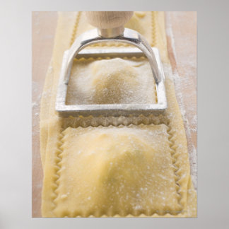 Ravioli with pastry cutter, close up poster