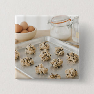 Raw cookies on baking tray 15 cm square badge
