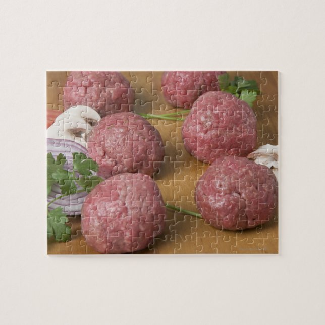 Raw meatballs on a cutting board jigsaw puzzle (Horizontal)