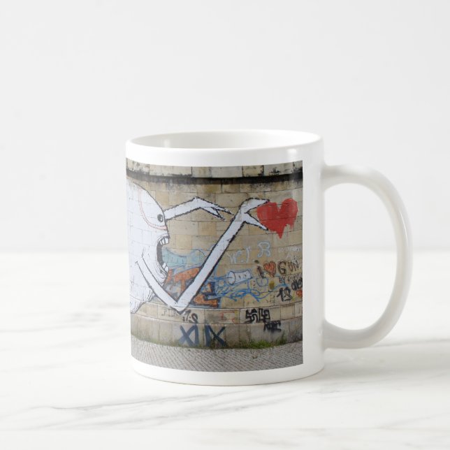 Reaching for a heart coffee mug (Right)