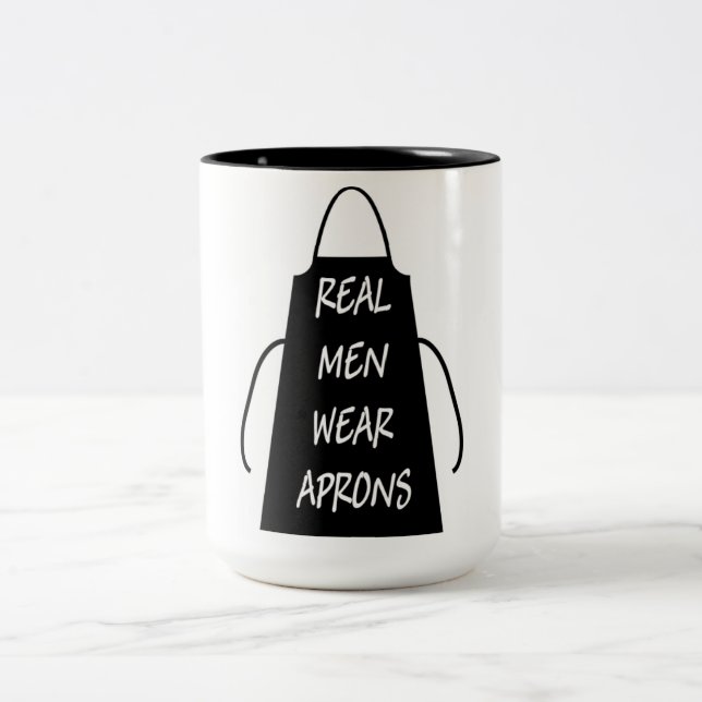 Real Men Wear Aprons (Black) Two-Tone Coffee Mug (Center)