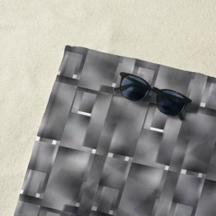Rectangular forms of grey color and dark spots beach towel