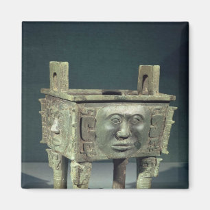 Rectangular 'ting' vessel with human faces magnet