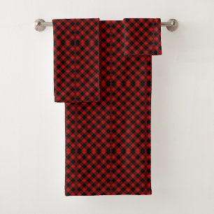 Red and black plaid towels hang on a silver towel