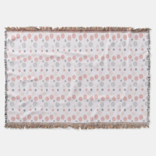 Red and blue circles on white throw blanket