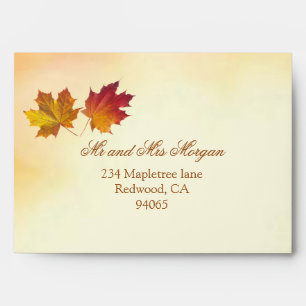 Red and gold autumnal maple leaves envelope