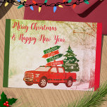 Red and Green Family Truck Vintage Merry Christmas Holiday Card<br><div class="desc">Rustic vintage Christmas red truck with family names sign and carrying a Christmas tree. So warm and vintage style to share with family and friends this Christmas season.</div>