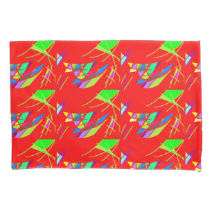 Red and green patterned design on two pillowcases