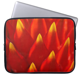 Red and green plant in close up photography laptop sleeve