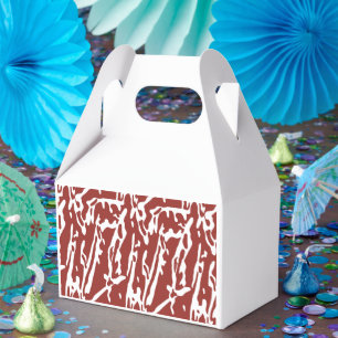 Red and orange abstract shapes blend and overlap a favour box