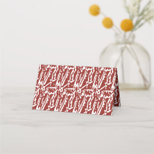 Red and orange abstract shapes blend and overlap a place card