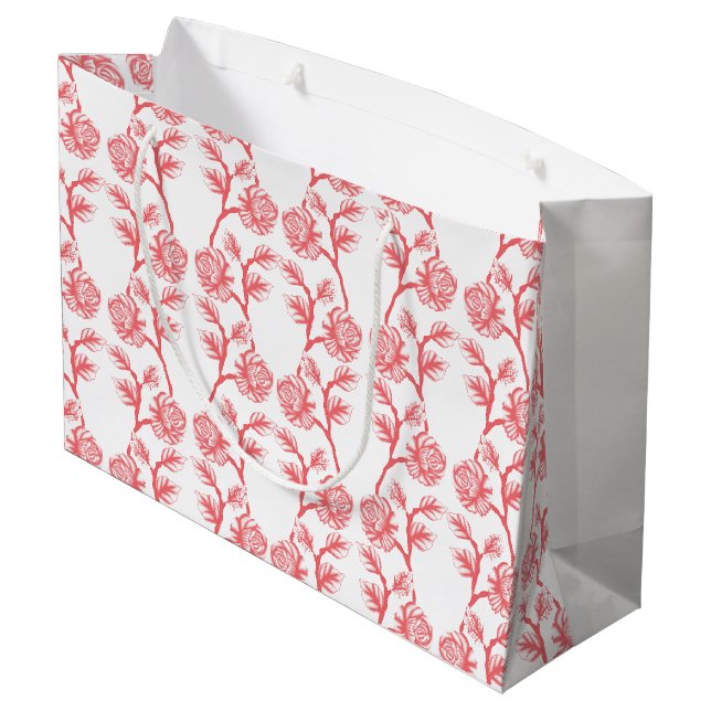 Red and pink wrapping paper featuring a repeating  large gift bag (Back Angled)
