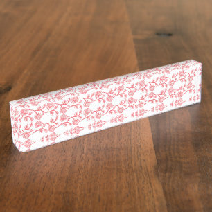Red and pink wrapping paper featuring a repeating nameplate