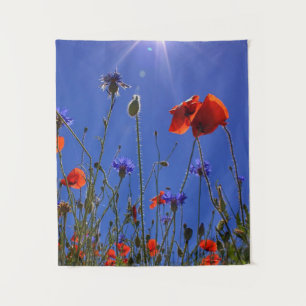 red and purple roses embracing a blue sky and sun tapestry