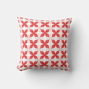 Red and white geometric pattern featuring stylised cushion