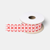 Red and white geometric pattern featuring stylised