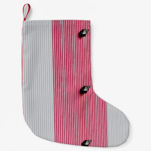 Red and white textile small christmas stocking