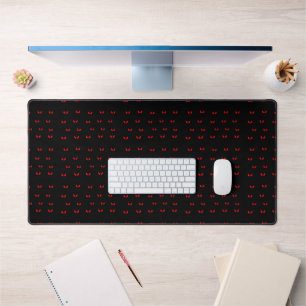 Red angry eyes in the dark desk mat