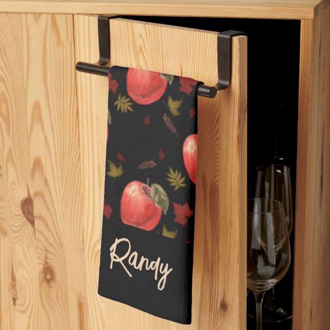 Red apples and leaves on black tea towel (Thirds Fold)