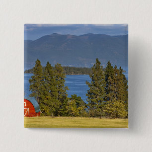 Red barn sits along scenic Flathead Lake near 15 Cm Square Badge