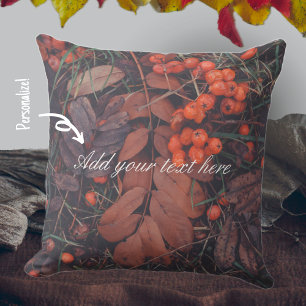 Red berries and brown autumn leaves cushion