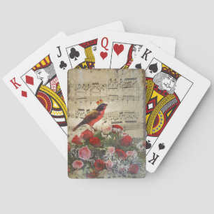 Red bird, & roses on vintage music sheet playing cards