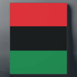 Red, Black and Green Flag Plaque<br><div class="desc">The 3 Pan-African colours on the flag represent: RED: the blood that unites all people of Black African ancestry, and shed for liberation; BLACK: black people whose existence as a nation, though not a nation-state, is affirmed by the existence of the flag; and GREEN: the abundant natural wealth of Africa....</div>