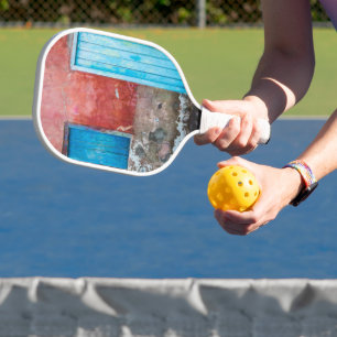 Red, blue and grey wall, door and window pickleball paddle