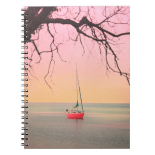 RED BOAT ON BEACH DURING SUNSET NOTEBOOK
