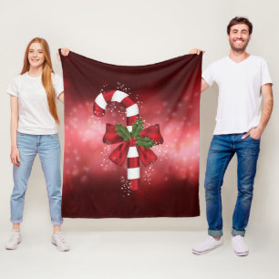 Red Candy Cane On A Red Bokeh Background Fleece Blanket