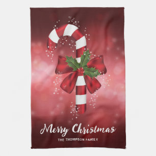 Red Candy Cane On A Red Bokeh Background Tea Towel