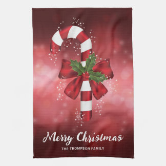 Red Candy Cane On A Red Bokeh Background Tea Towel