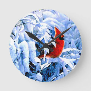 Red Cardinal In the Winter Snow Round Clock
