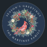 Red Cardinal Pine Wreath Season's Greetings Classic Round Sticker<br><div class="desc">Add a special touch to your envelopes or gift giving. Designed to coordinated with the Elegant Christmas Wreath and Cardinal collection. A red cardinal is nestled in a traditional pine wreath decorated with berries,  pinecones and flowers. Greeting is written above and your name below.</div>