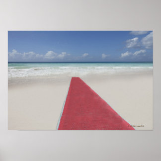 Red carpet on a beach poster