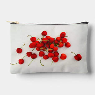 Red Cherries in Natural Light Lay on White Accessory Pouch