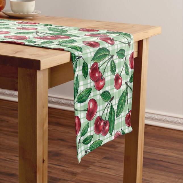 Red cherries on light green gingham short table runner (In Situ)