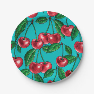 Red cherries on turquoise paper plate