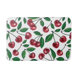 Red cherries on white bath mat