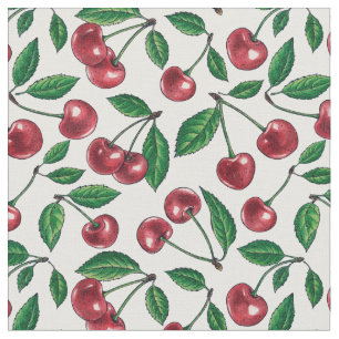 Red cherries on white fabric