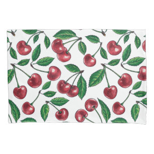 Red cherries on white pillowcase