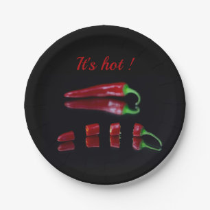 Red chilli on black photo with text paper plate